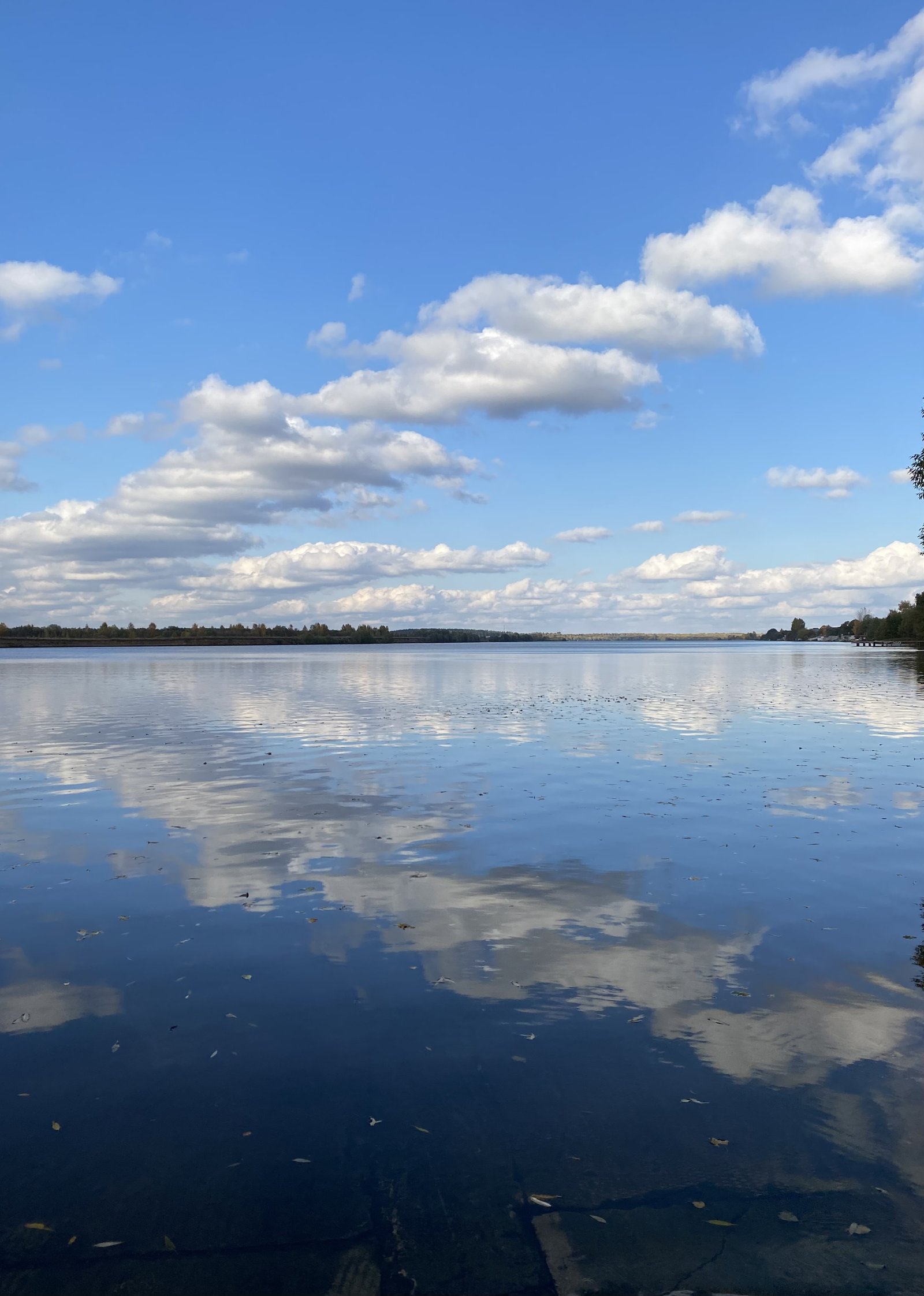 Clouds reflected in still water